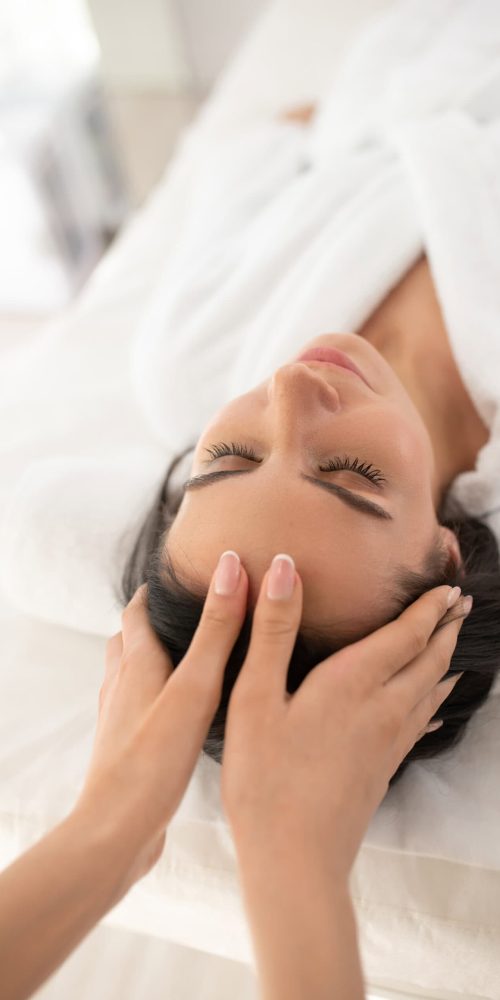 Woman receiving a calming massage at Armonía Natural Massage Therapy.